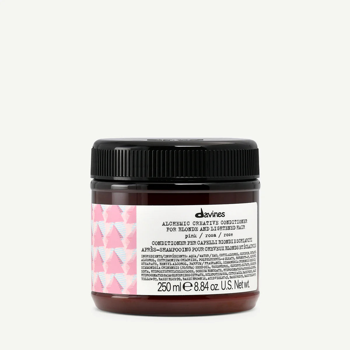 Burk med Alchemic Creative Conditioner Pink balsam för blont och ljusare hår, med rosa detaljer på etiketten och svart lock.