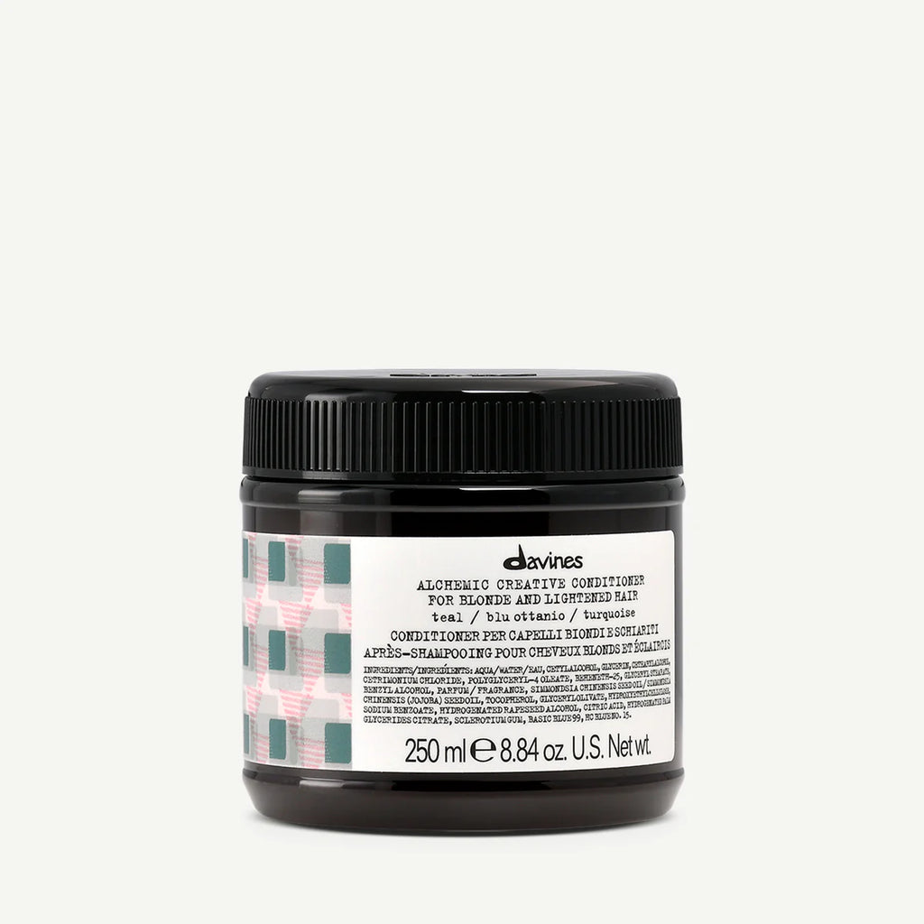 Alchemic Creative Conditioner Teal i en brunsvart burk med svart lock, balsam för blont och ljusfärgat hår som ger en intensiv teal-ton.