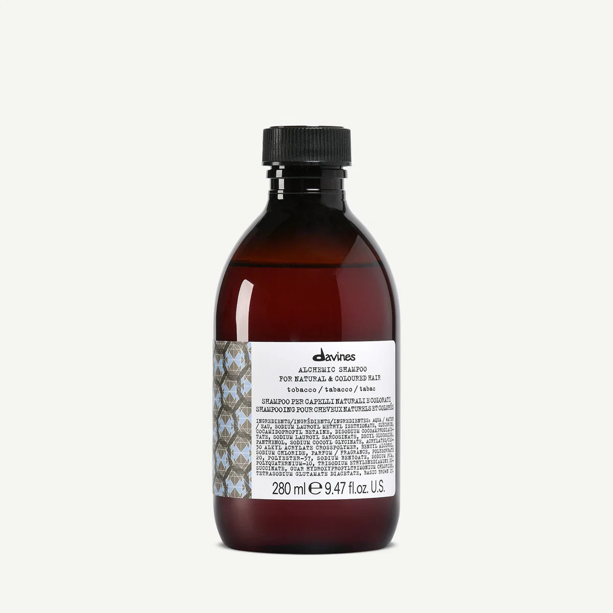 Flaska med Alchemic Shampoo Tobacco schampo i brun förpackning, designad för naturligt och färgat hår, innehållande 280 ml miljövänlig hårvårdsprodukt.