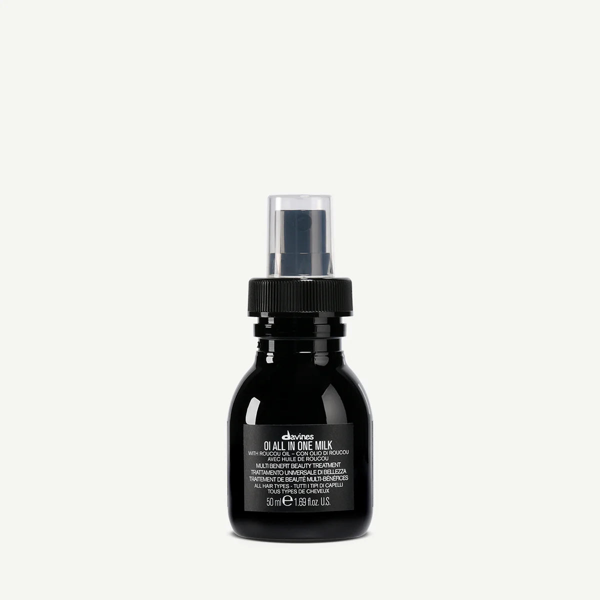 Svart pumpflaska med mjölkliknande hårvårdsprodukt OI/All In One Milk från Davines, perfekt för styling och vård av hår.