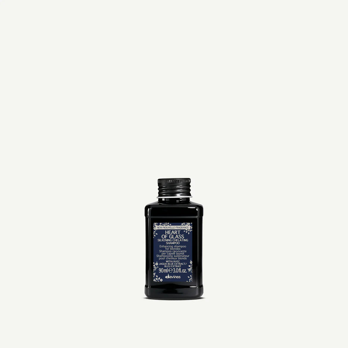 Heart of Glass Silkening Shampoo i en liten svart flaska med blå etikett, ett milt schampo som ger silkeslent och glänsande hår.