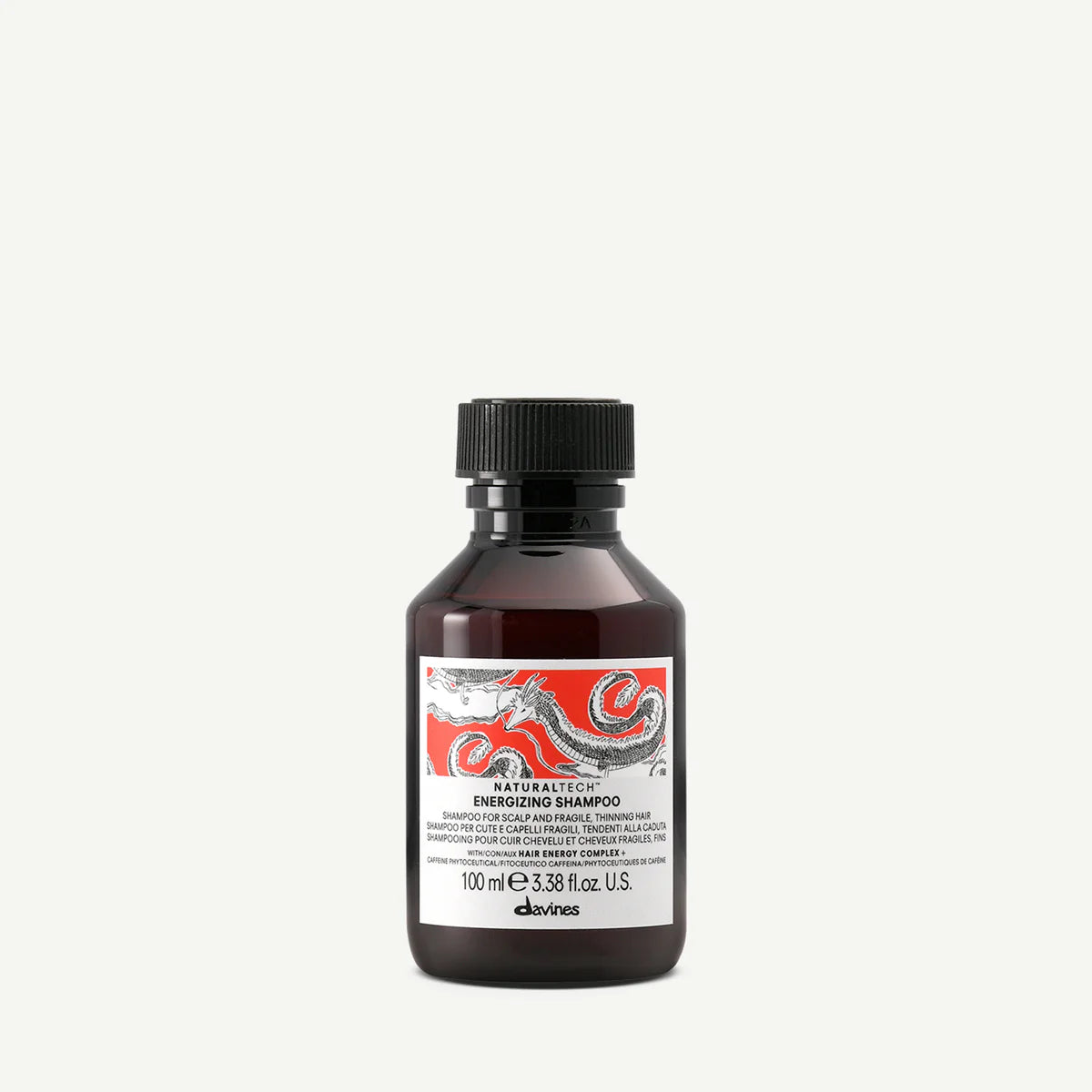 Flaska med Naturaltech Energizing Shampoo för hår och hårbotten, miljövänligt schampo i liten förpackning från Davines med energigivande formula.