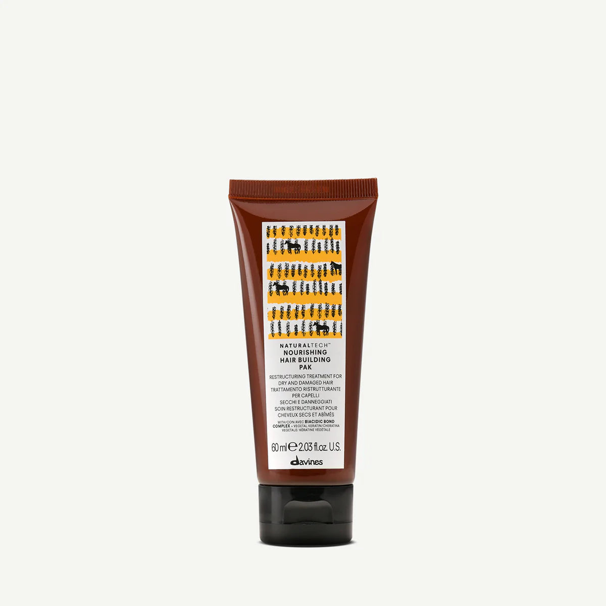 Naturaltech Nourishing Hair Building Pak i en brun tub, en miljövänlig hårinpackning från Davines för närande och stärkande hårvård.