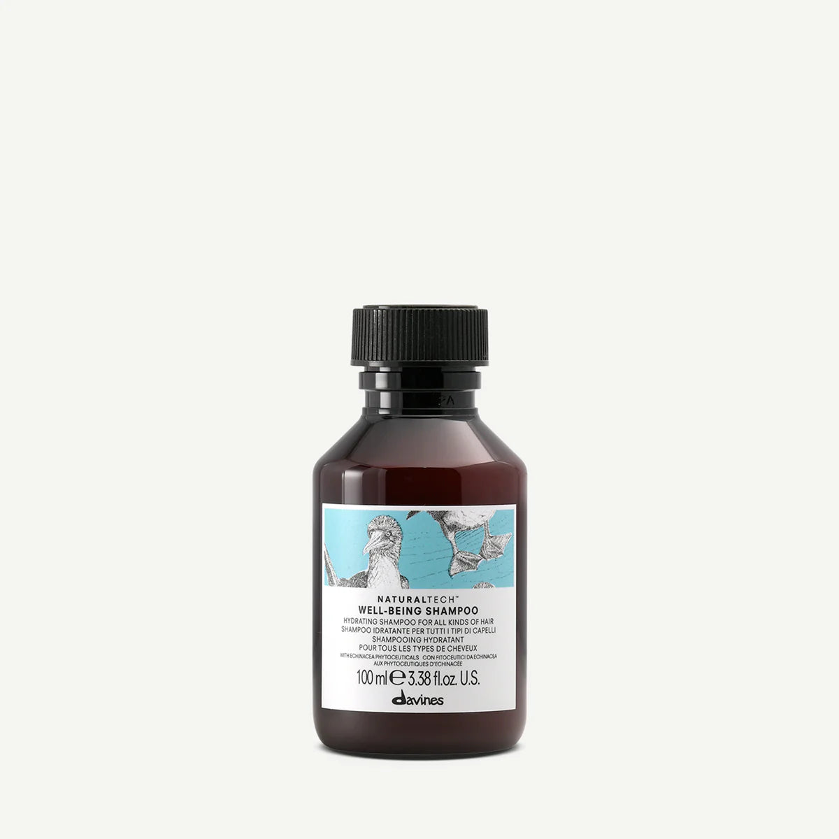 Flaska med Naturaltech Well-Being Shampoo, en miljövänlig schampo, med brun och svart design som passar för alla hårtyper.