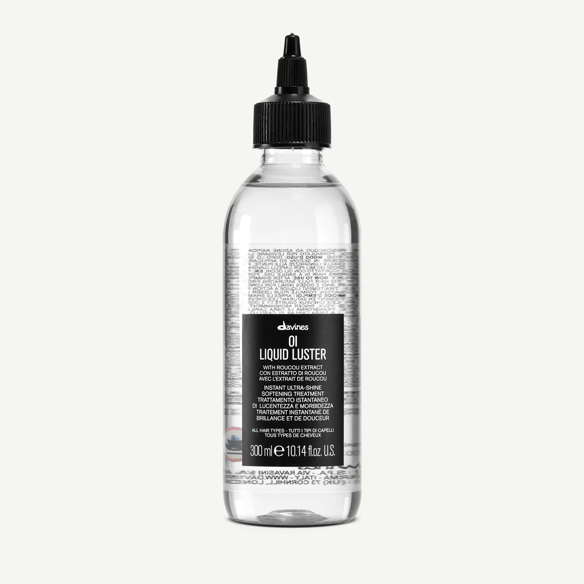 Transparent flaska med svart kork och appliceringspip för OI/Liquid Luster, ett styling- och vårdande hårprodukt med återfuktande egenskaper.