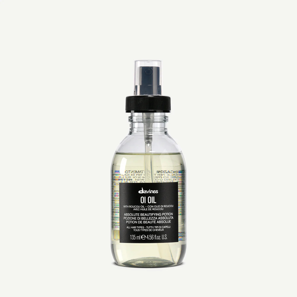 Transparent flaska med pump innehållande OI/Oil hårvårdsprodukt från Davines, en stylingolja som ger glans och vård till håret.