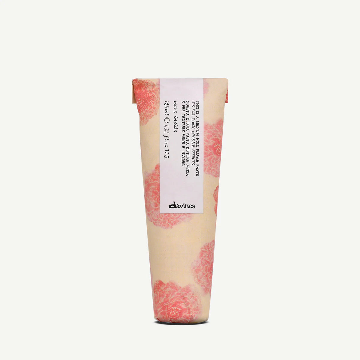 Davines This is a Medium Hold Pliable Paste i en dekorativ tub med blommönster, en miljövänlig stylingprodukt för hår med medium stadga.