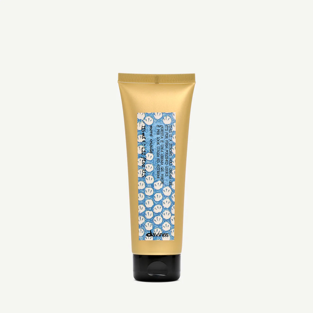 This is a Strong Hold Cream Gel i gul tub med svart lock, en stylingprodukt för starkt och hållbart hårfäste.