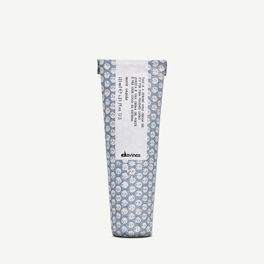 This is a Strong Hold Cream Gel i elegant blå förpackning med vitt mönster, en effektiv stylingprodukt från Davines för starkt och hållbart hår.