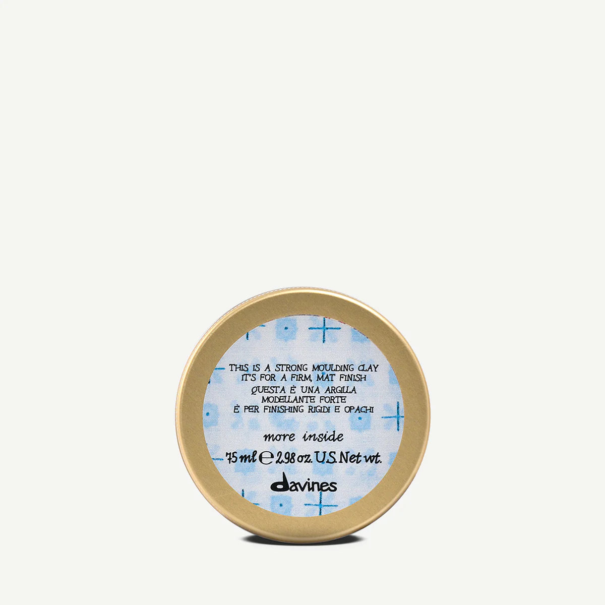 This is a Strong Moulding Clay i en rund burk från Davines, hårstylingprodukt för fast, matt finish, perfekt för formning och hållbar styling.