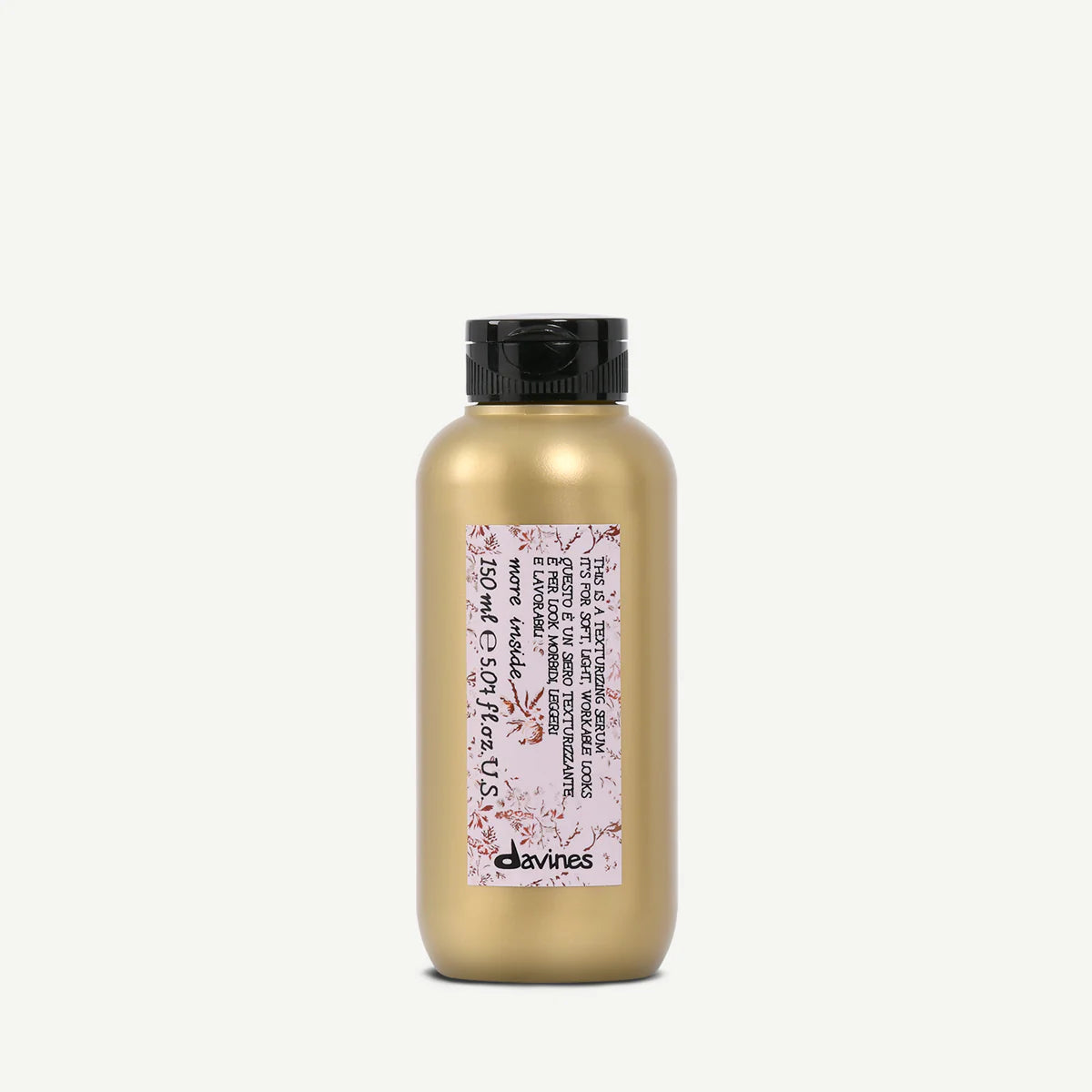This is a Texturizing Serum i en matt guldflaska med svart kork, en stylingprodukt för textur och volym i håret.