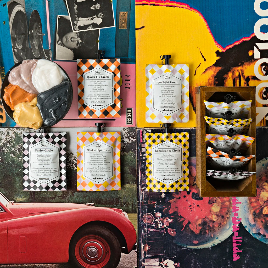 Färgglada förpackningar av miljövänliga hårvårdsprodukter i serien The Restless Circle arrangerade på ett kreativt collage med vintagebilder och en röd bil.
